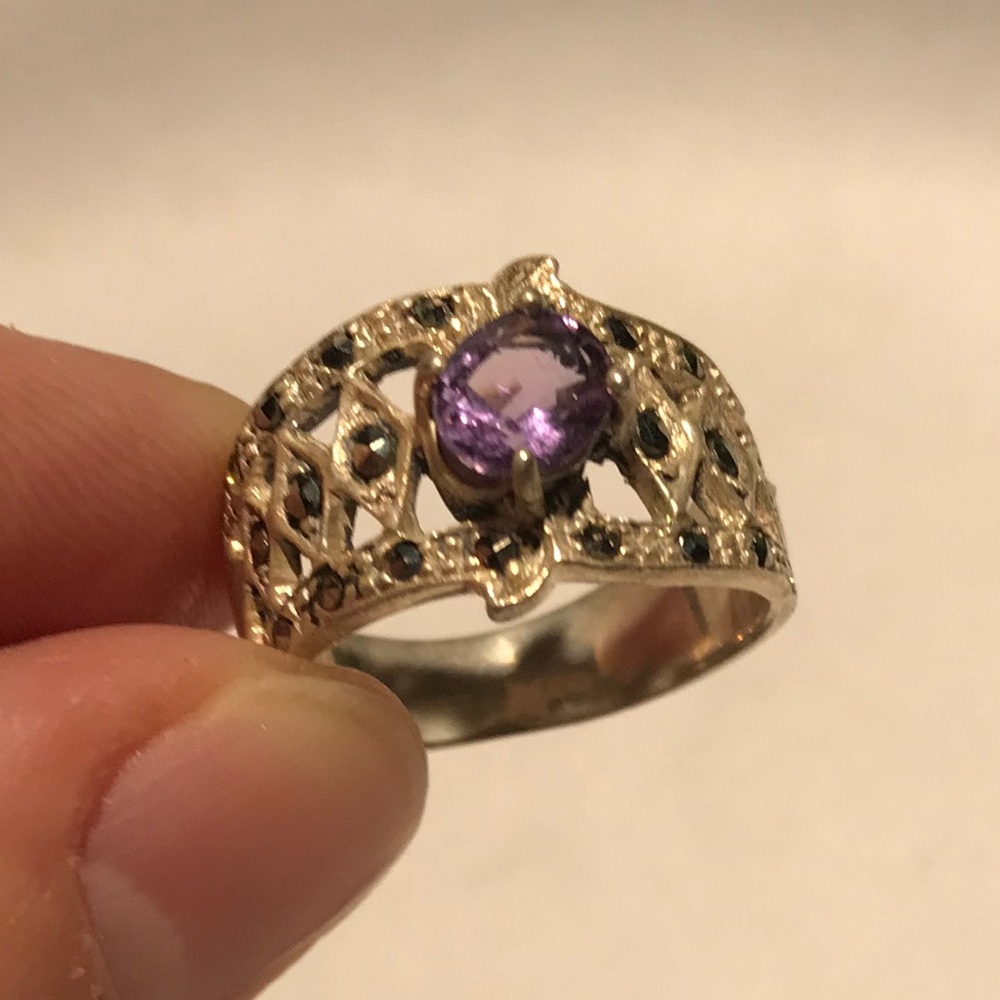Marcasite sterling silver ring with purple stone.